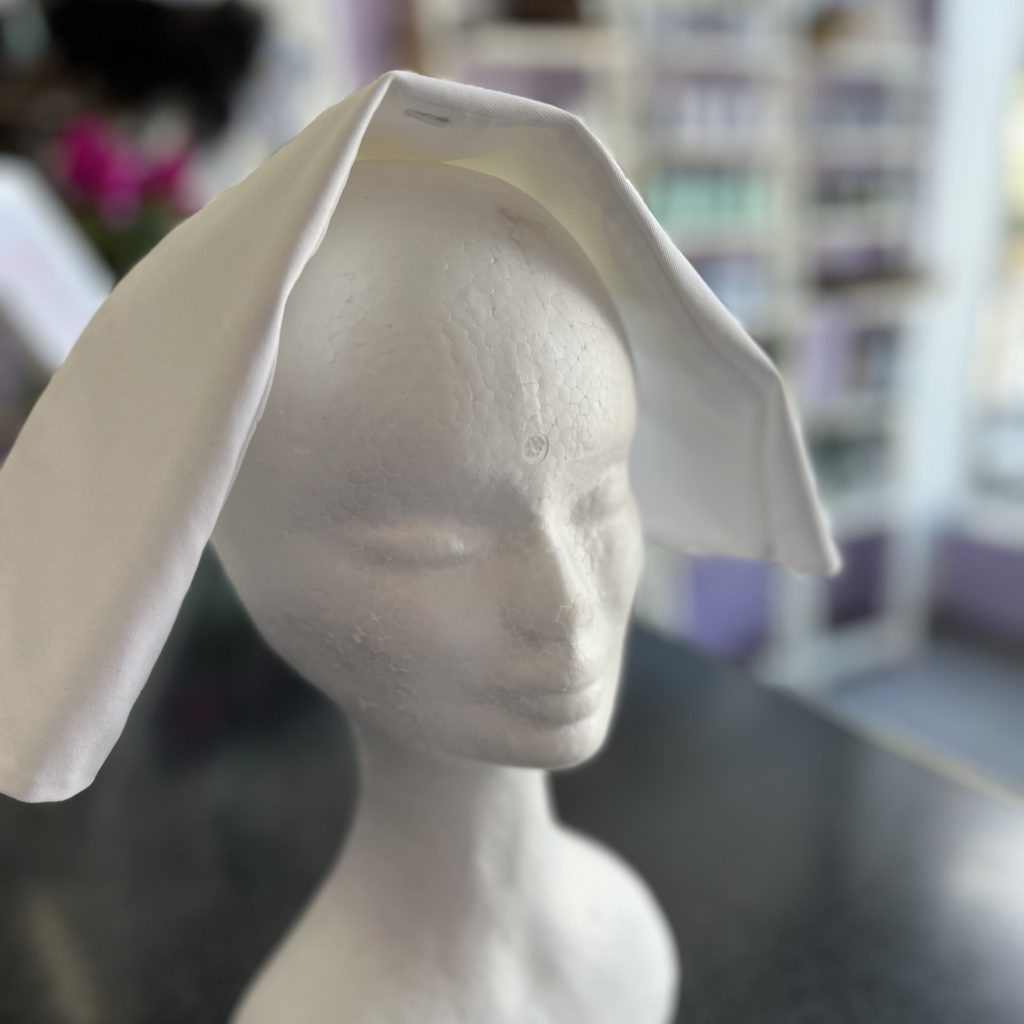A clean white starched 1930's nurse cap